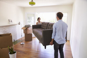 mountain-heating-and-cooling-couple-moving-in-couch